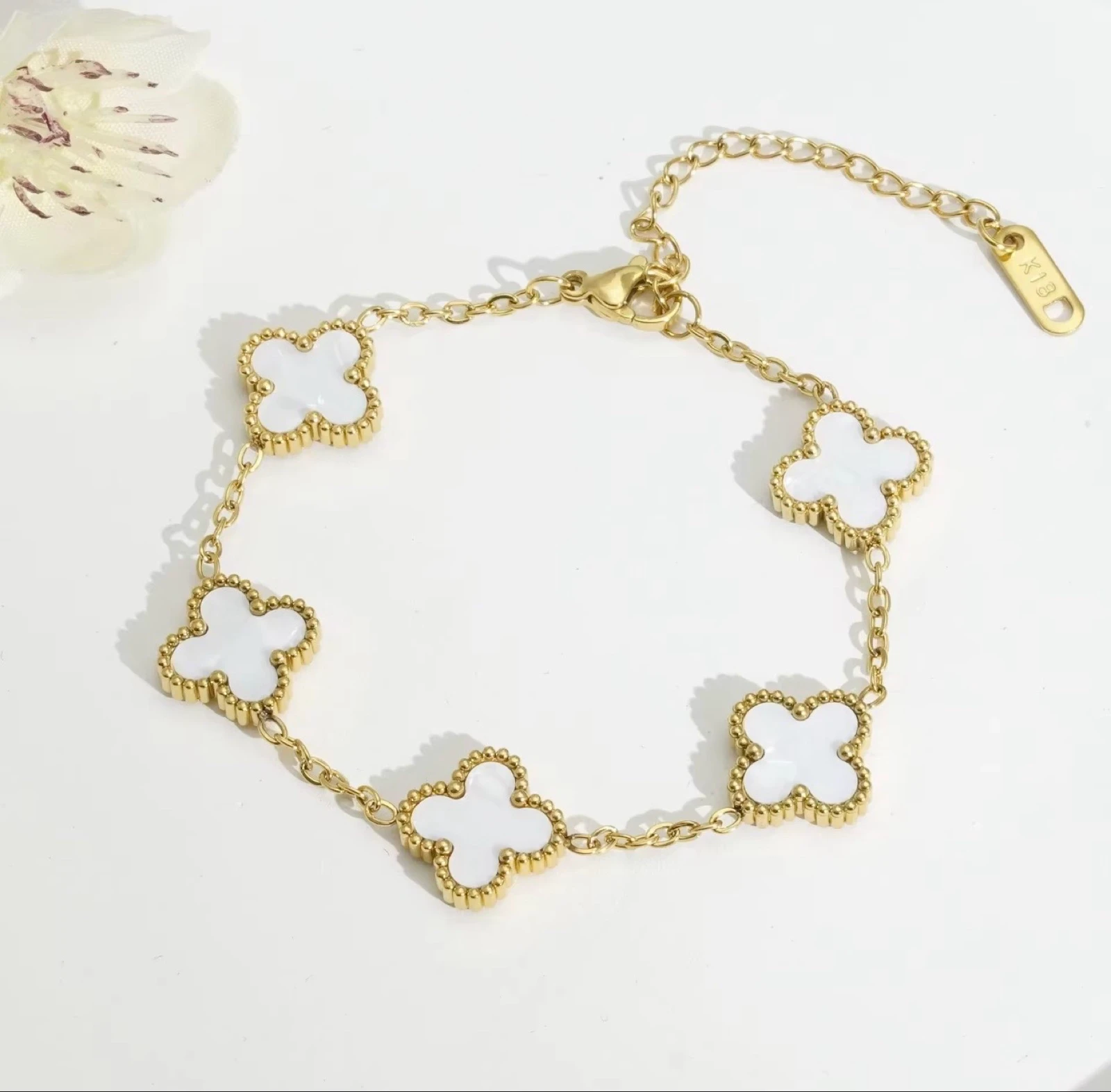 Bracelet trèfles doré et blanc 